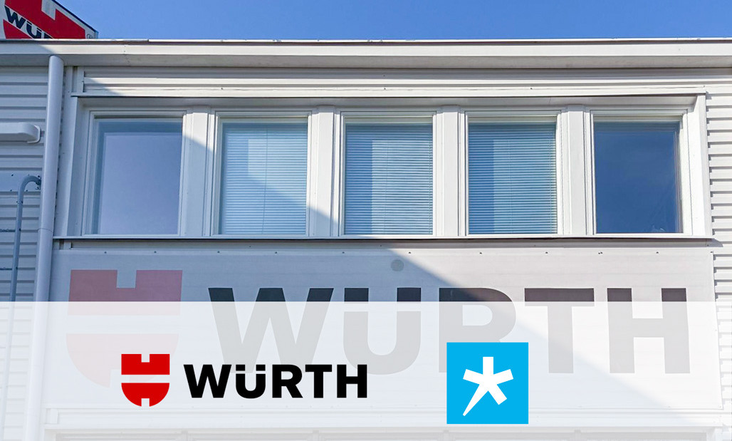 Wurthin rakennuksen julkisivu, jossa yrityksen nimi isolla, sekä kuvan päällä Wurthin ja Spesian logot yhteistyön merkiksi.