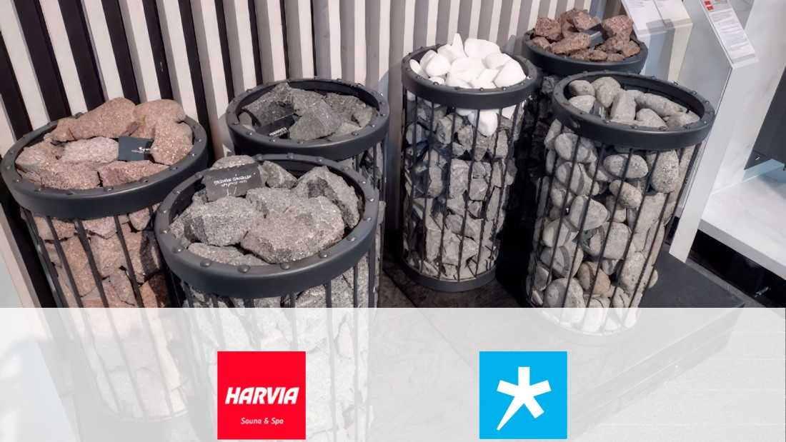 Harvian kiuaskiviä esillä kuudessa korissa, Harvian ja Spesian logot.